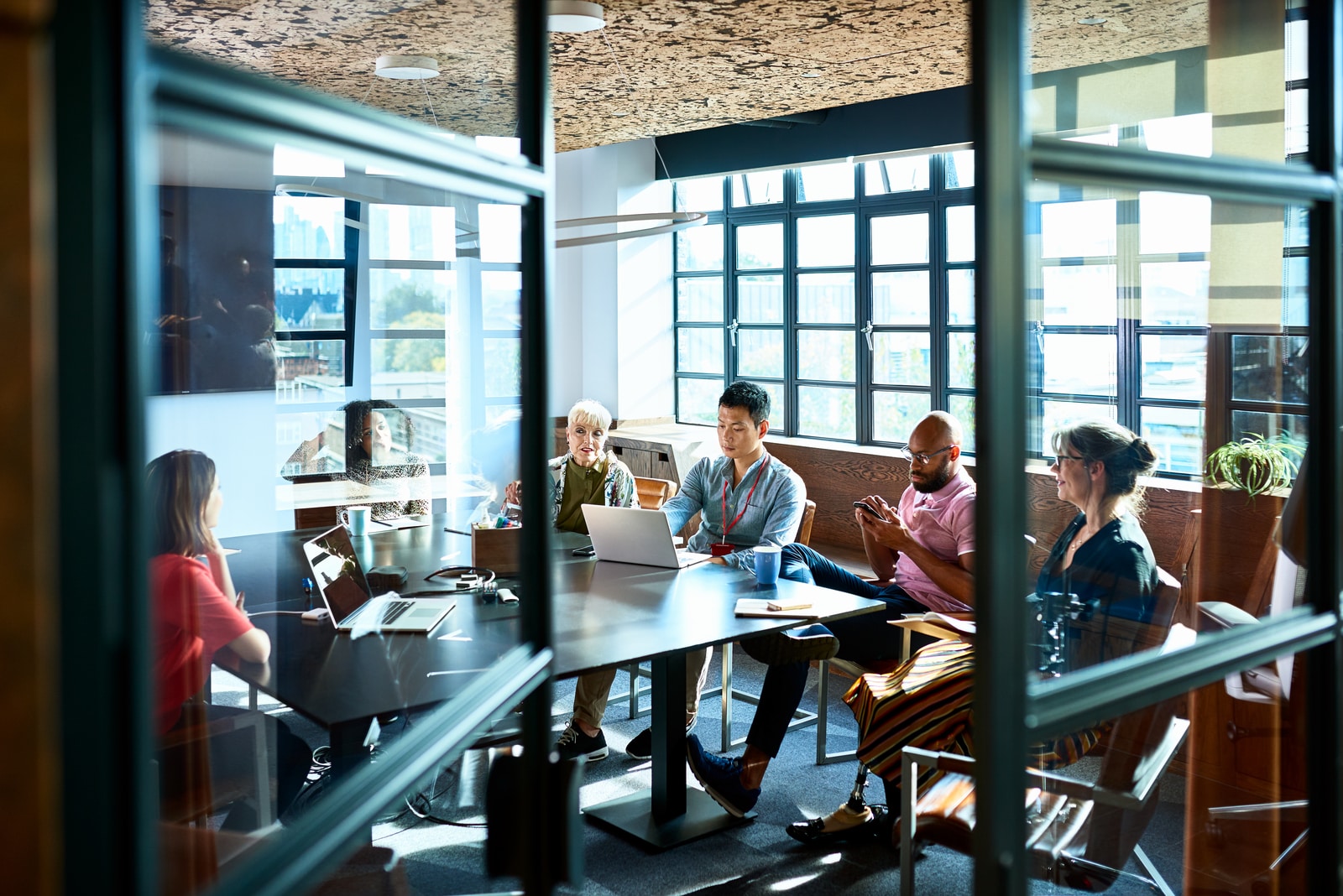 Female Chief Analyst Holds Meeting Presentation for a Team of Economists
