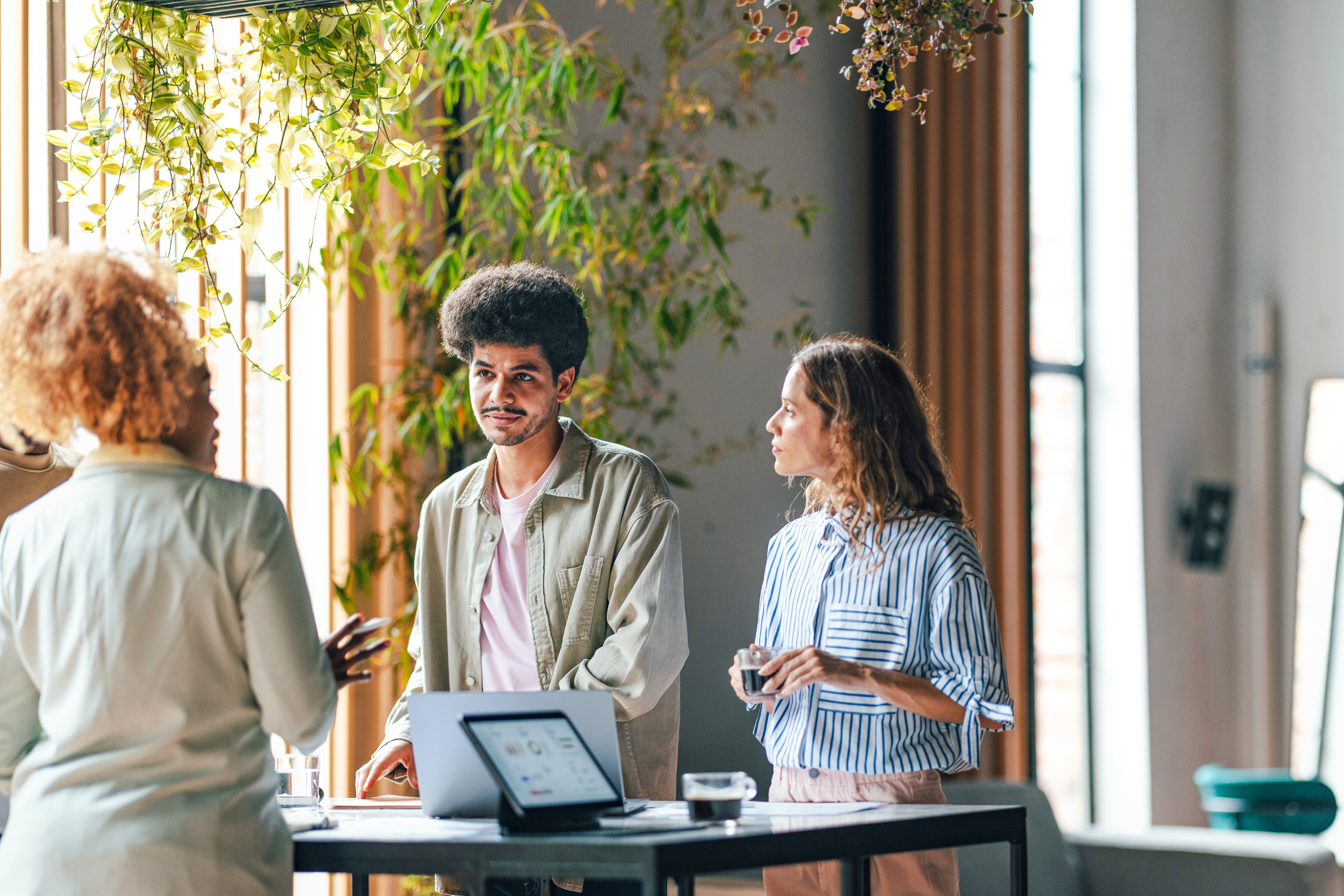Group of 3 people talking