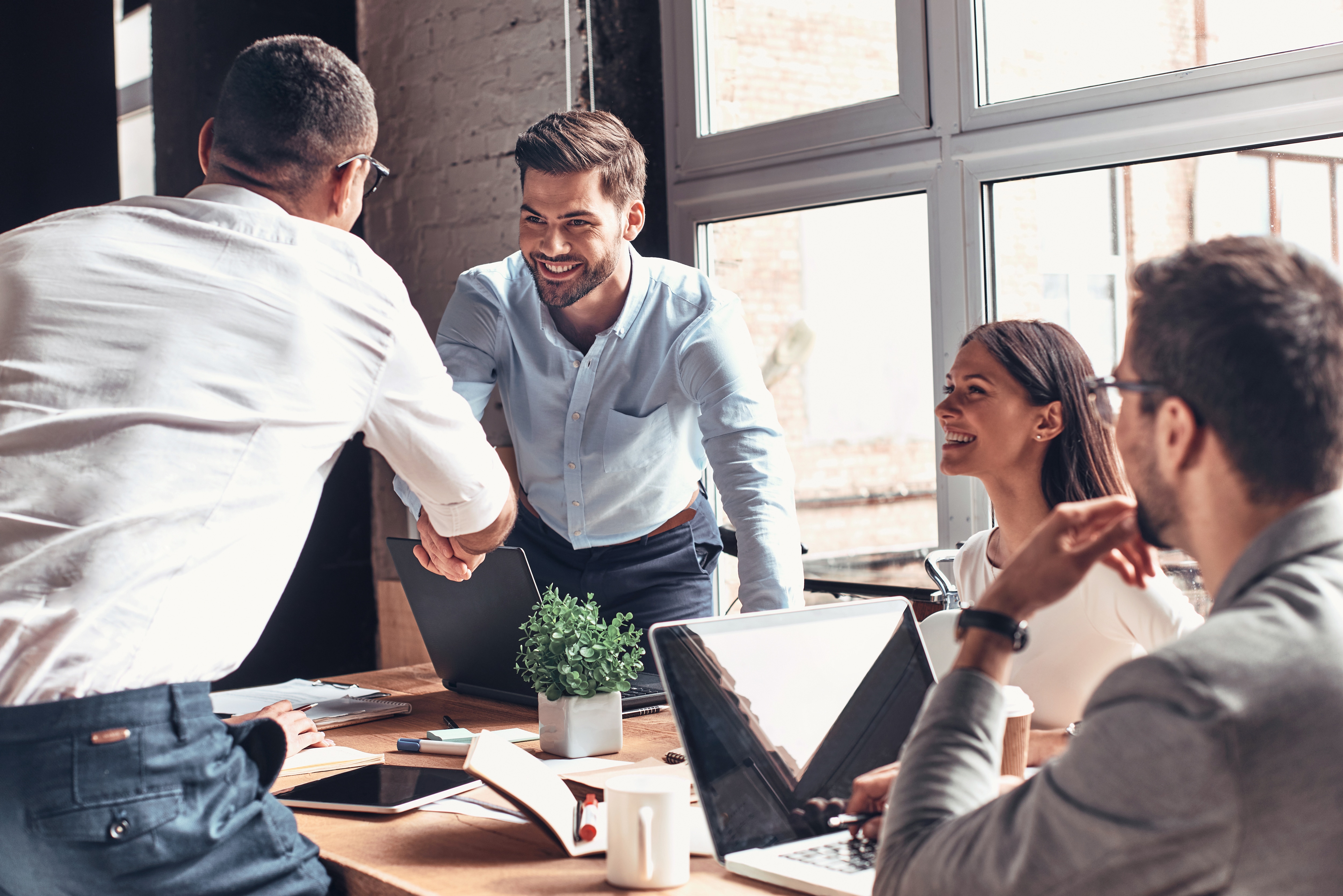office workspace with many people working together