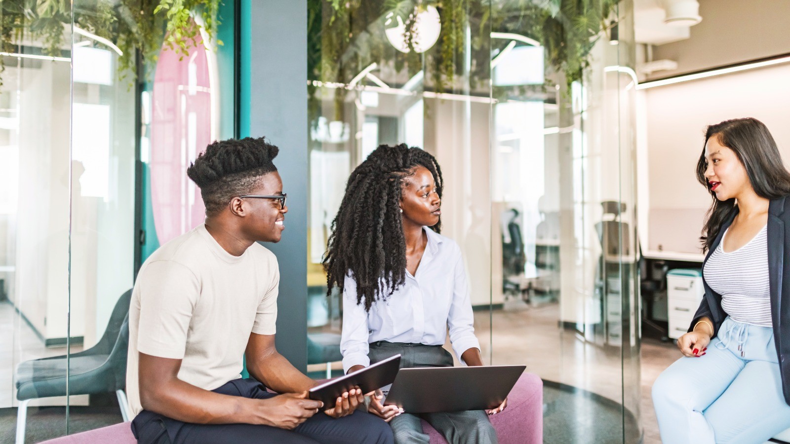three people working together in the office