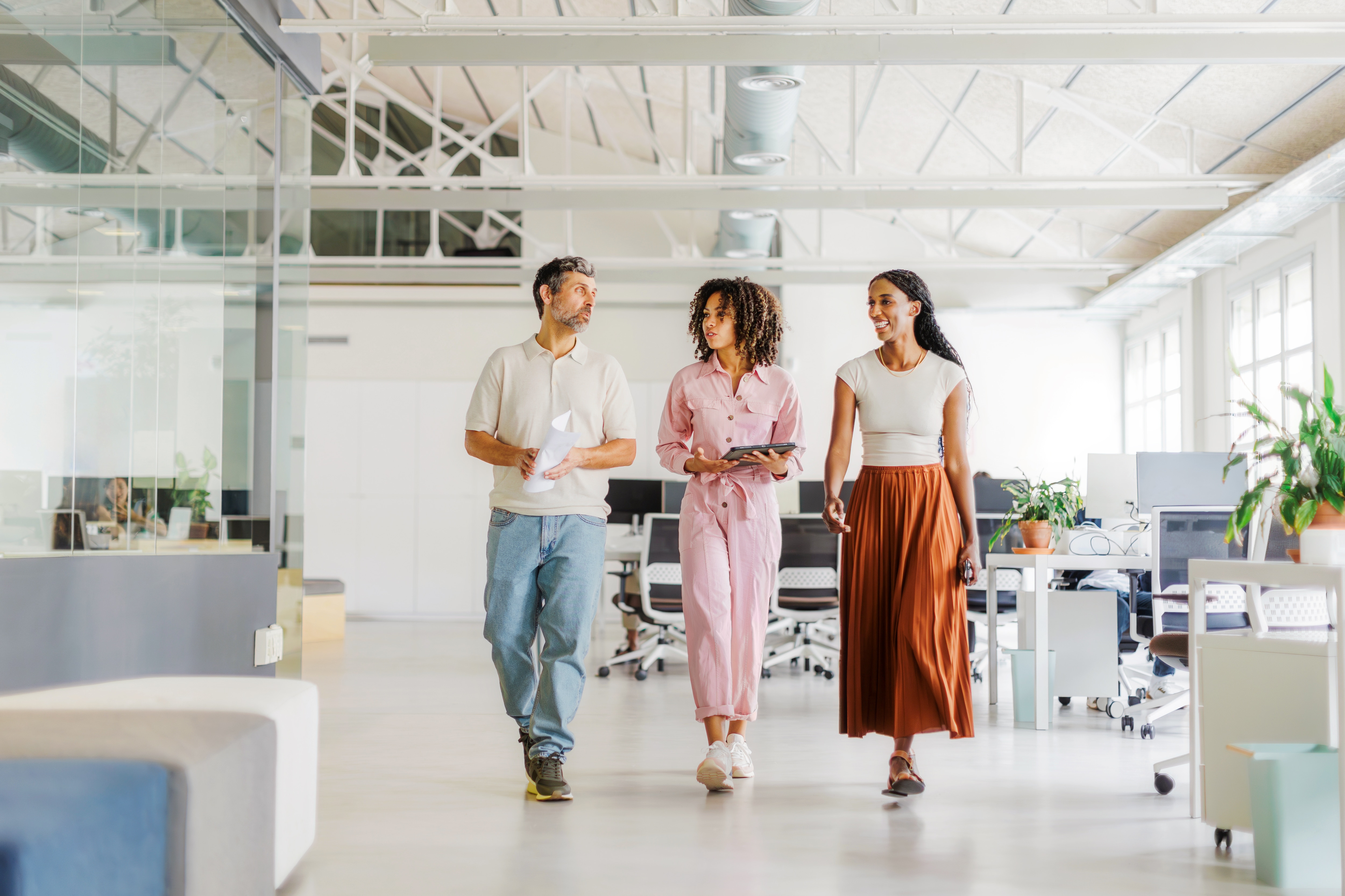 three people working together in the office
